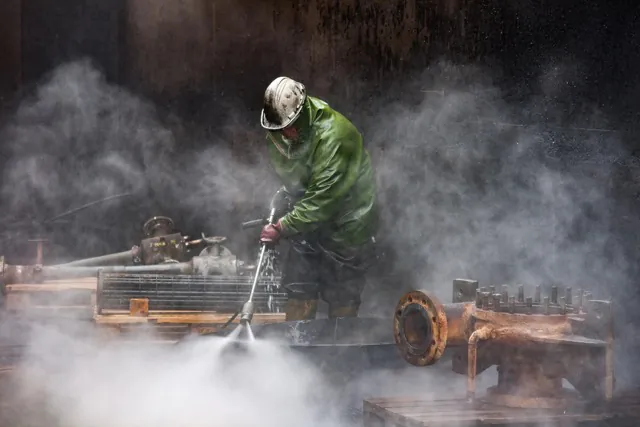 Industrial worker cleaning